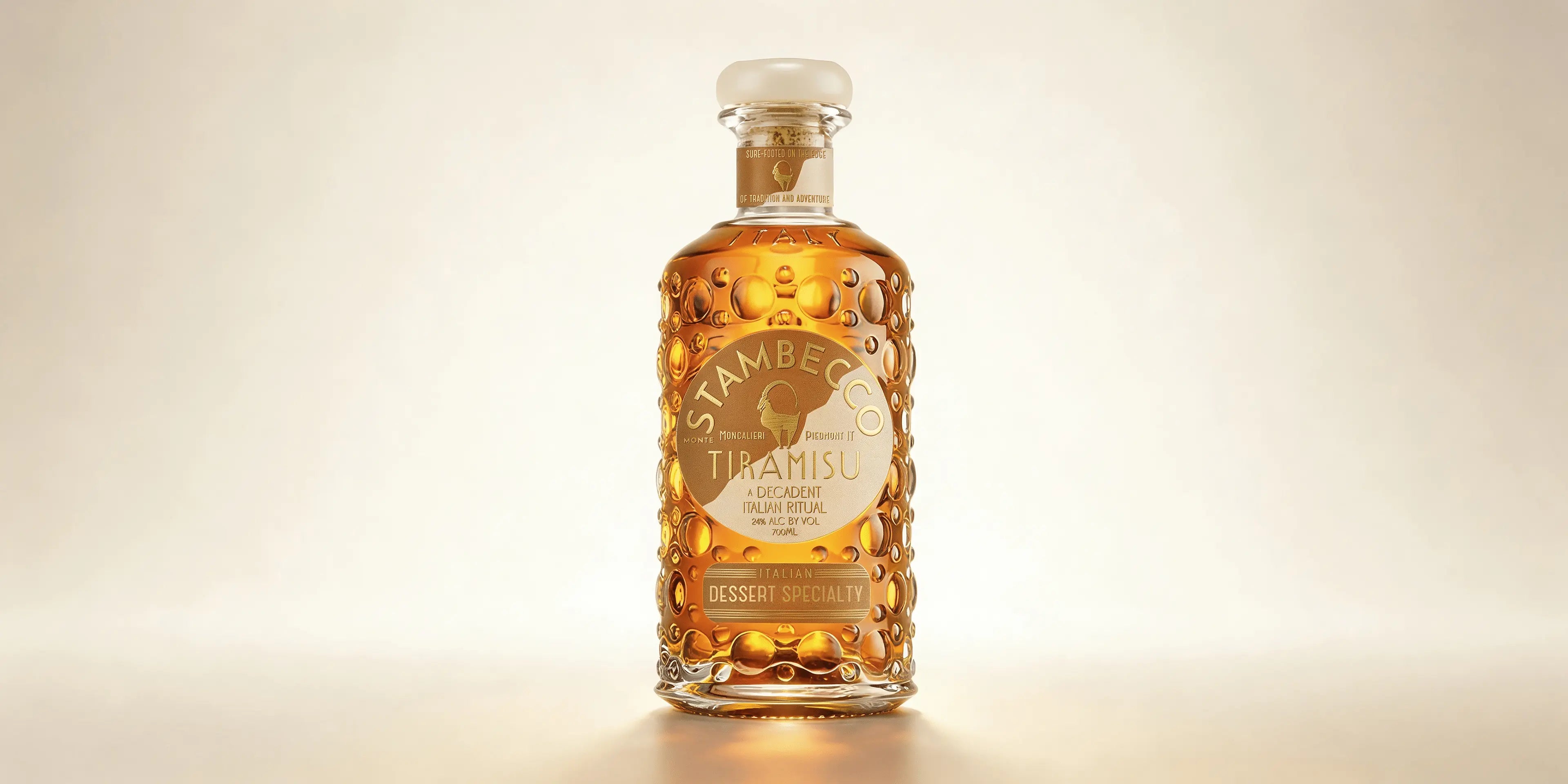 A bottle of Stambecco Tiramisu Liqueur on a light background